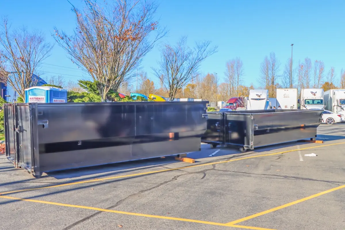 Professional dumpster rental service with roll-off container on residential driveway in Midwest City